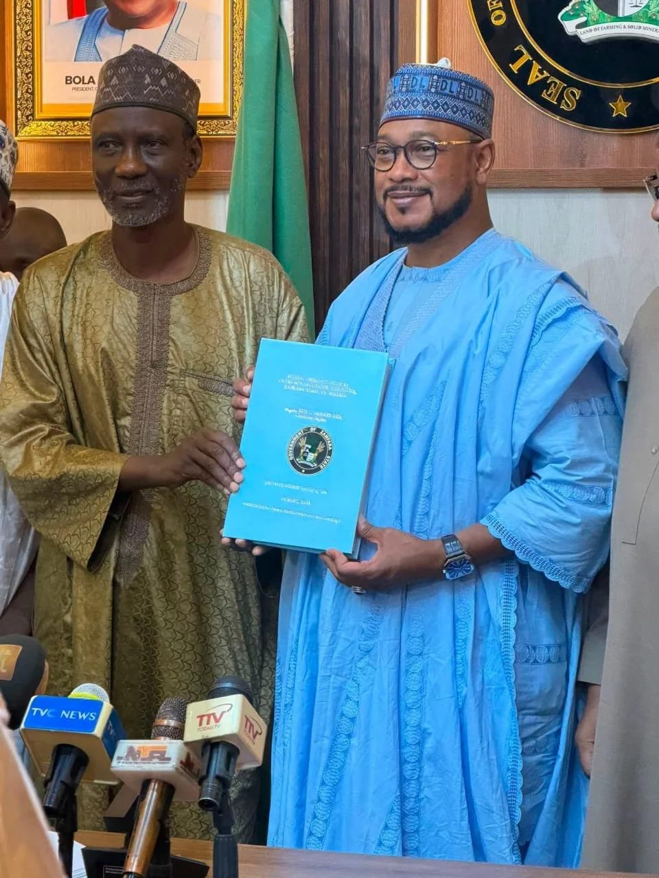 Prof. Ismaila A. Mungadi handing over the outreach report to Governor Dauda Lawal